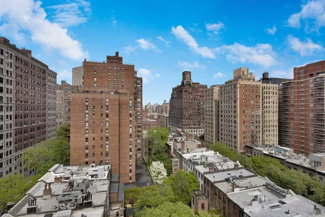 a front view of a building with garden