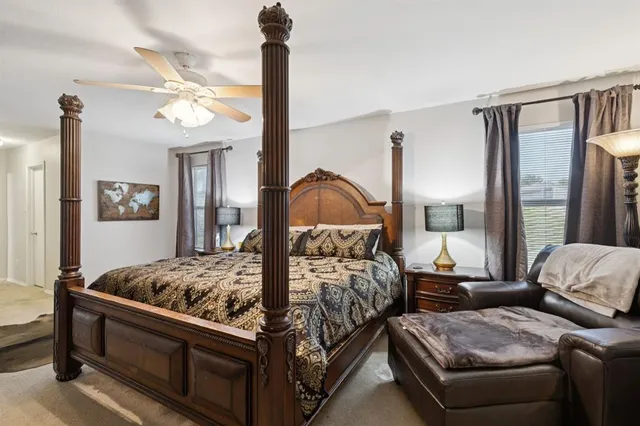 a bedroom with furniture and a window