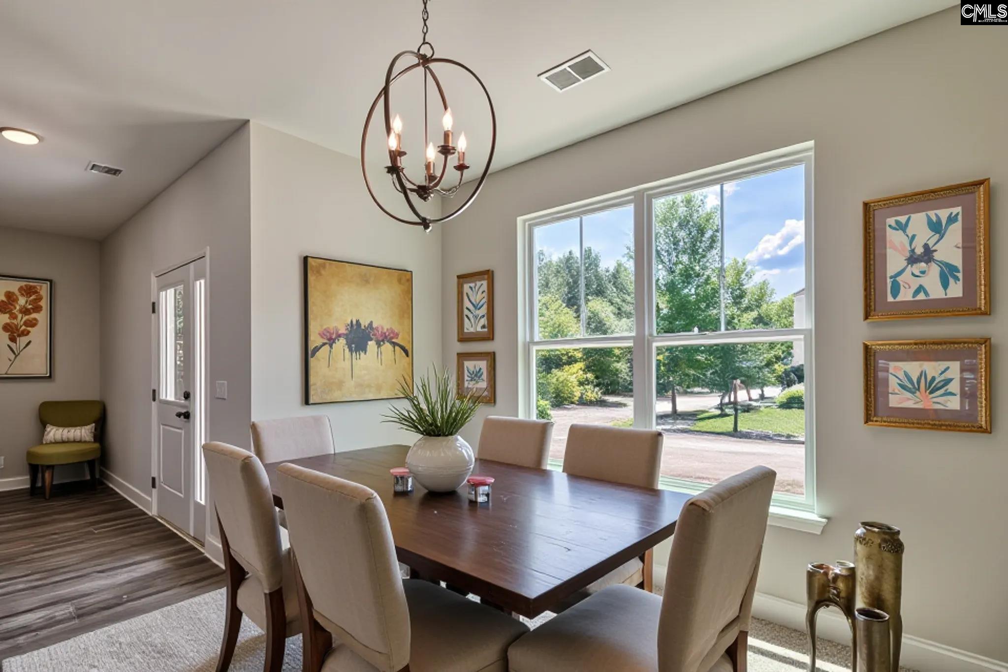 265 Eastover Road Eastover, SC 29044 - Photo 3 of 15 a view of a dining room with furniture window and wooden floor