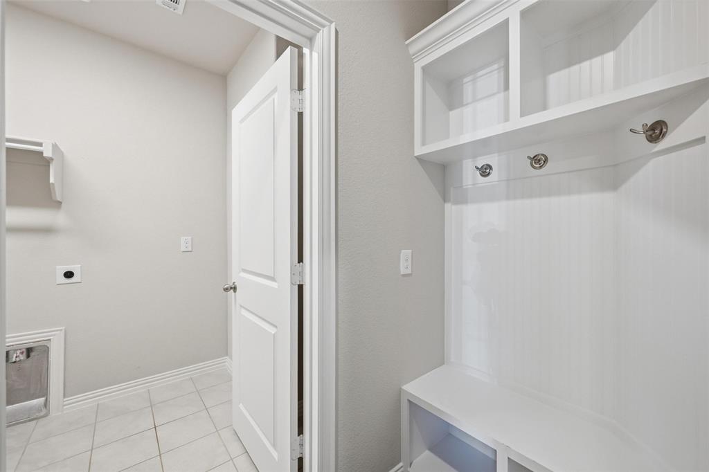 1116 Rountree Court Celina, TX 75009 - Photo 11 of 29 a bathroom with a sink and a mirror
