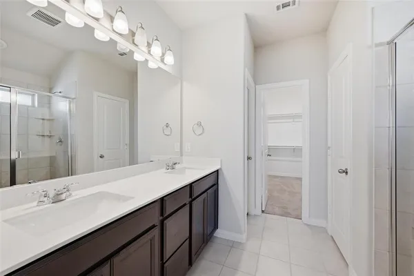 a bathroom with a shower and a sink