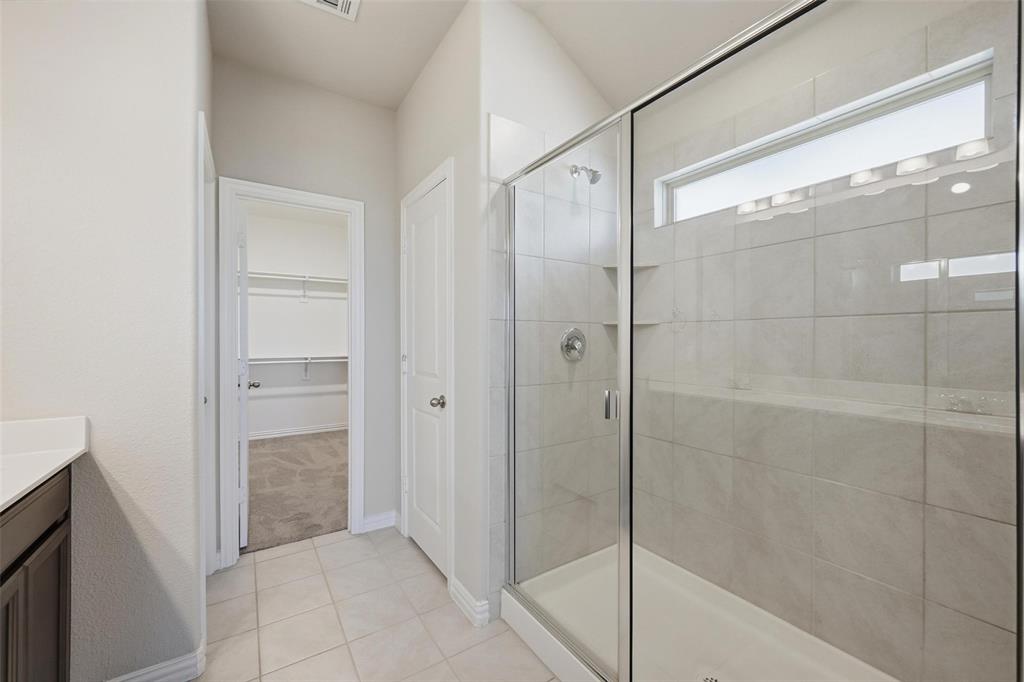 1116 Rountree Court Celina, TX 75009 - Photo 24 of 29 a bathroom with a shower and a sink