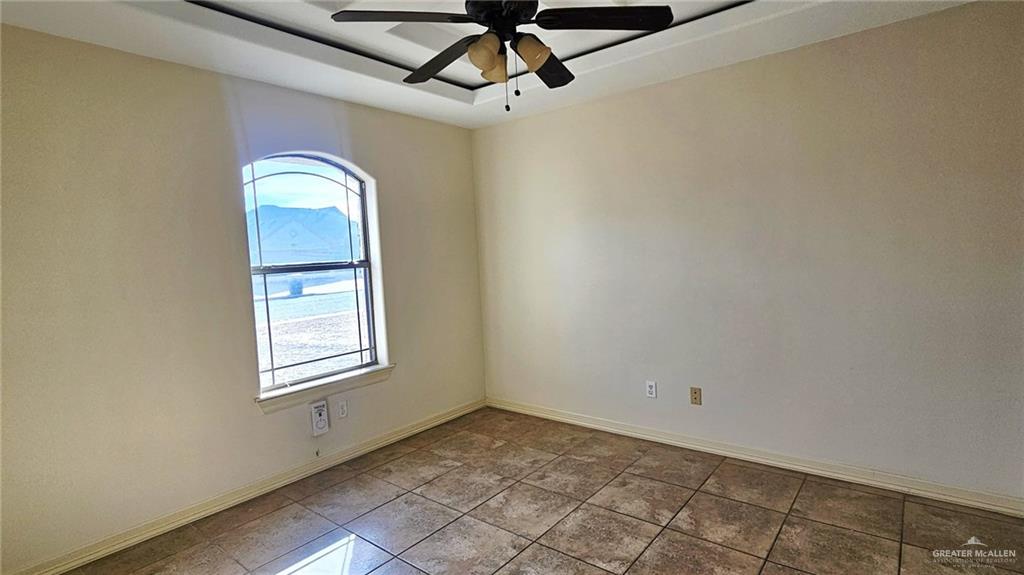 1004 West F Street Mission, TX 78572 - Photo 11 of 12 a view of a livingroom with a window and a ceiling fan