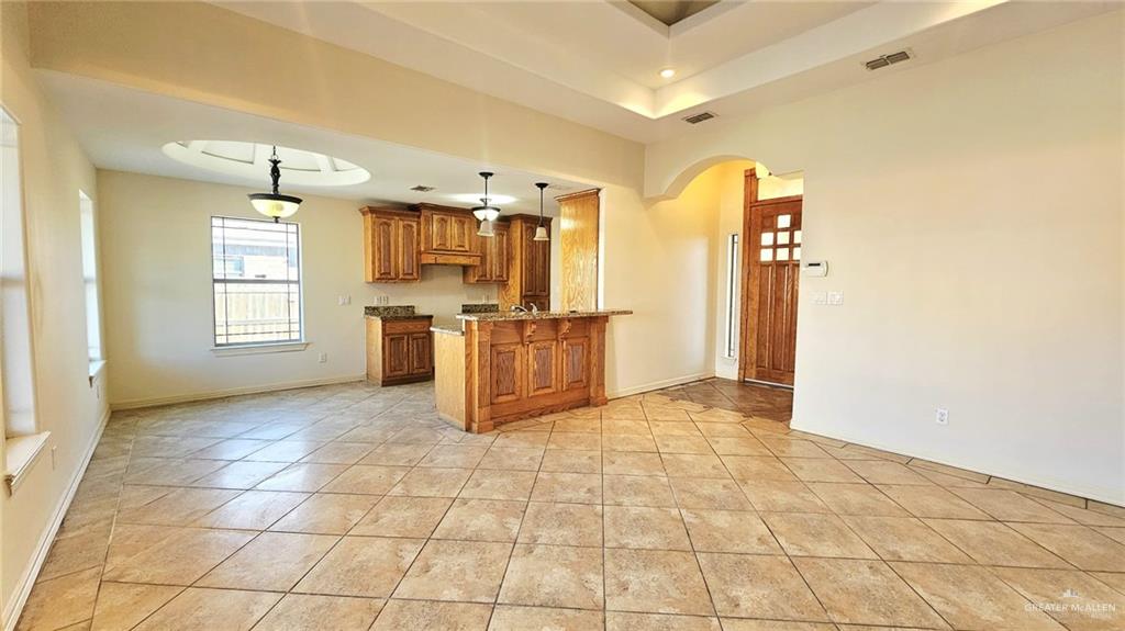 1004 West F Street Mission, TX 78572 - Photo 12 of 12 a view of a kitchen with furniture and a window