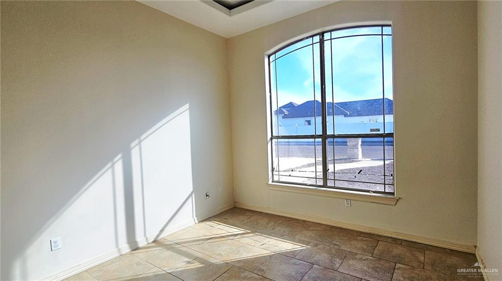 1004 West F Street Mission, TX 78572 - Photo 5 of 12 a view of an empty room and window
