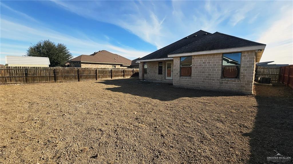 1004 West F Street Mission, TX 78572 - Photo 8 of 12 a front view of a house with a yard