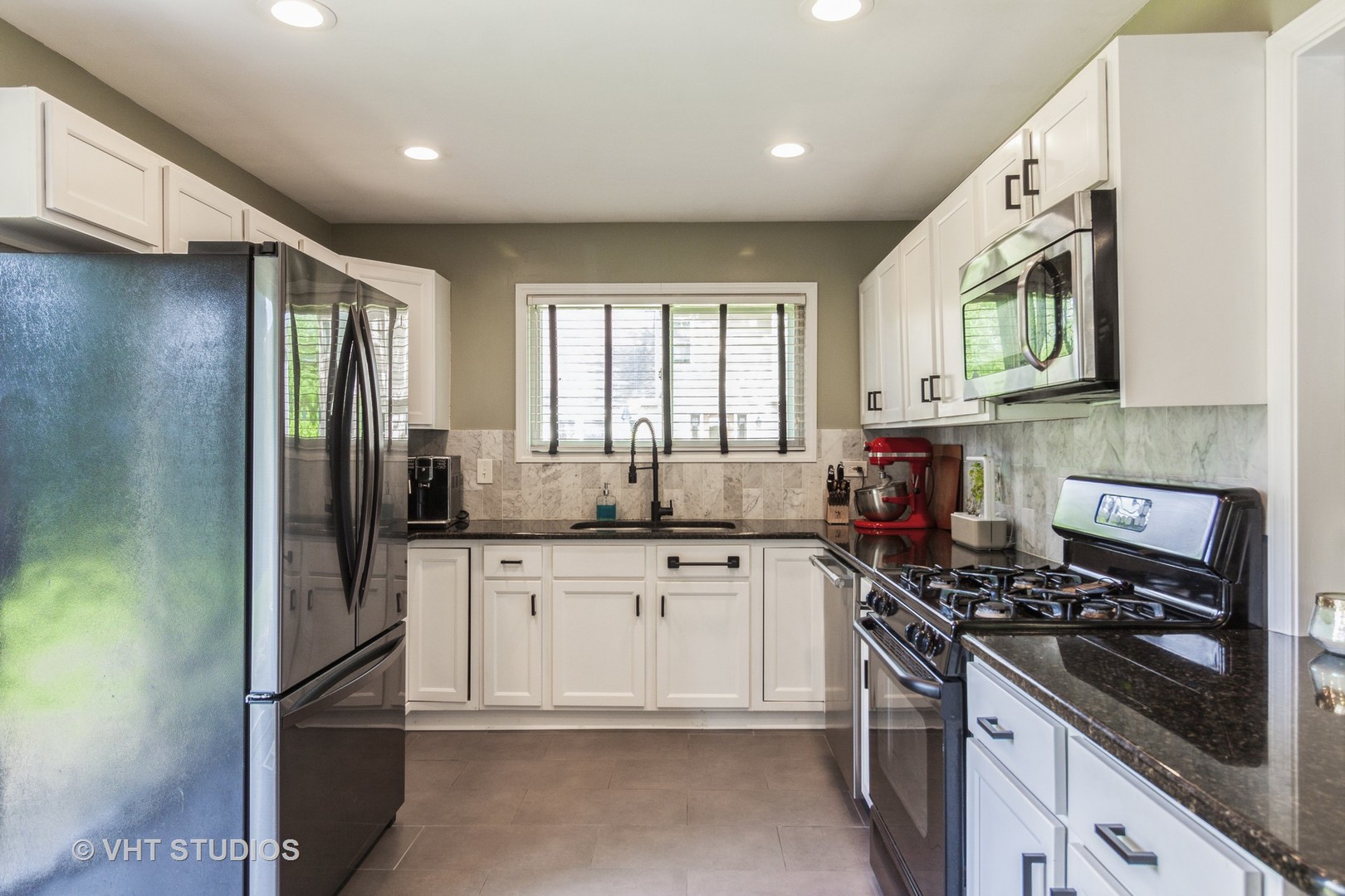 105 Cedarbrook Road Naperville, IL 60565 - Photo 5 of 11 a kitchen with stainless steel appliances granite countertop a stove a sink dishwasher a refrigerator and cabinets with wooden floor