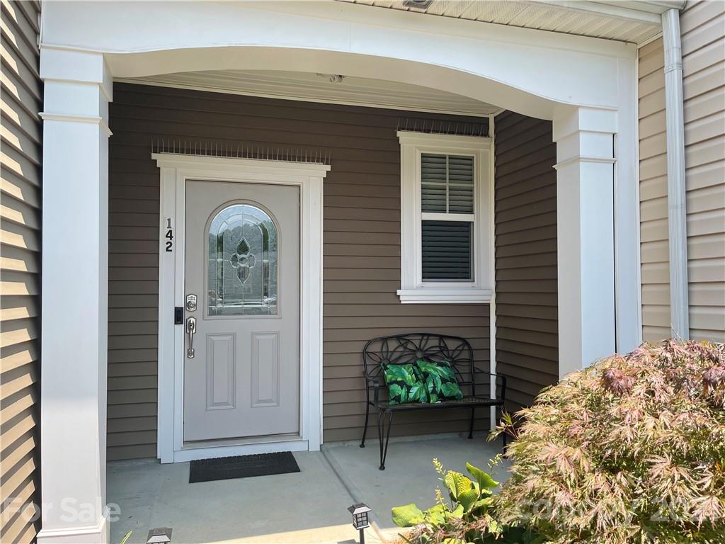 142 Council House Road Fort Mill, SC 29708 - Photo 2 of 32 a front view of a house with garden