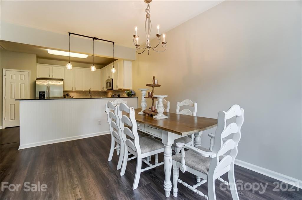 142 Council House Road Fort Mill, SC 29708 - Photo 15 of 32 a view of a dining room with furniture and chandelier