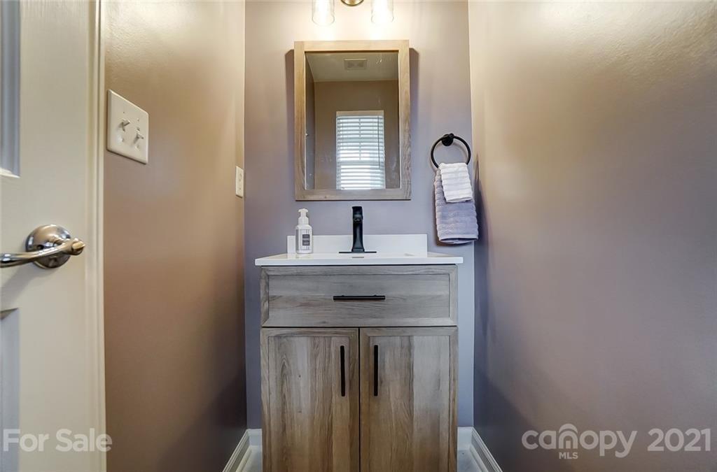 142 Council House Road Fort Mill, SC 29708 - Photo 16 of 32 a sink with a mirror