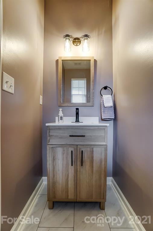 142 Council House Road Fort Mill, SC 29708 - Photo 17 of 32 a view of bathroom with a sink and a mirror