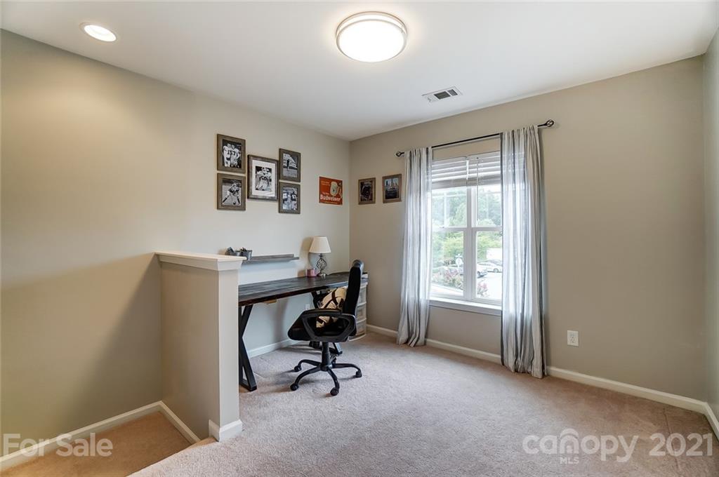 142 Council House Road Fort Mill, SC 29708 - Photo 19 of 32 a view of a workspace with furniture and a window