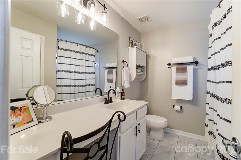 142 Council House Road Fort Mill, SC 29708 - Photo 24 of 32 a bathroom with a sink a toilet and shower