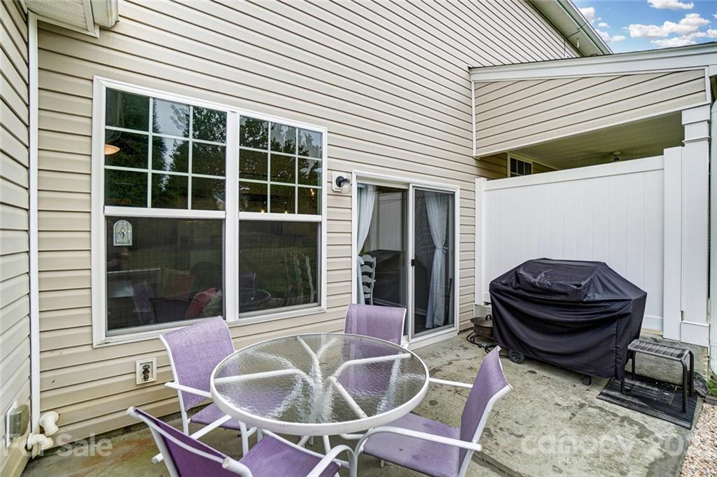 142 Council House Road Fort Mill, SC 29708 - Photo 31 of 32 a view of a patio with table and chairs