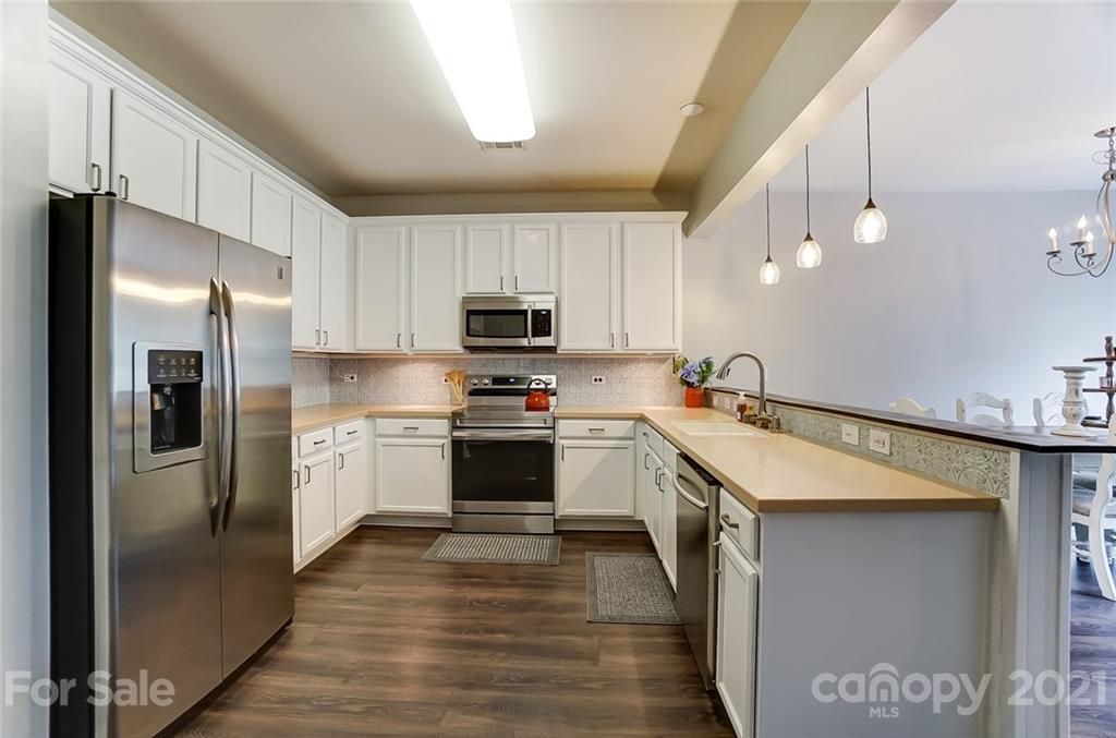 142 Council House Road Fort Mill, SC 29708 - Photo 5 of 32 a kitchen with stainless steel appliances a refrigerator sink and microwave
