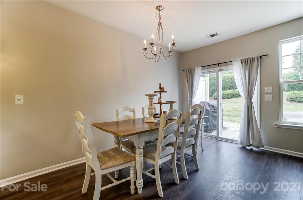 142 Council House Road Fort Mill, SC 29708 - Photo 10 of 32 a view of a dining room with furniture window and wooden floor