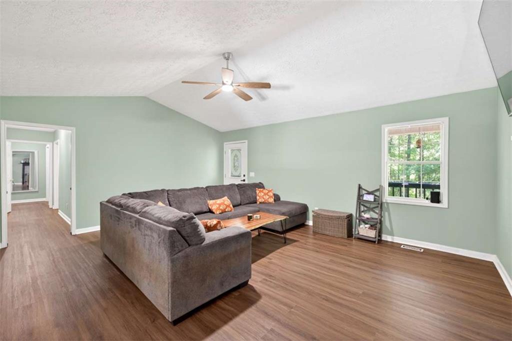 386 Ridgewood Drive Pendergrass, GA 30567 - Photo 8 of 50 a living room with furniture and wooden floor