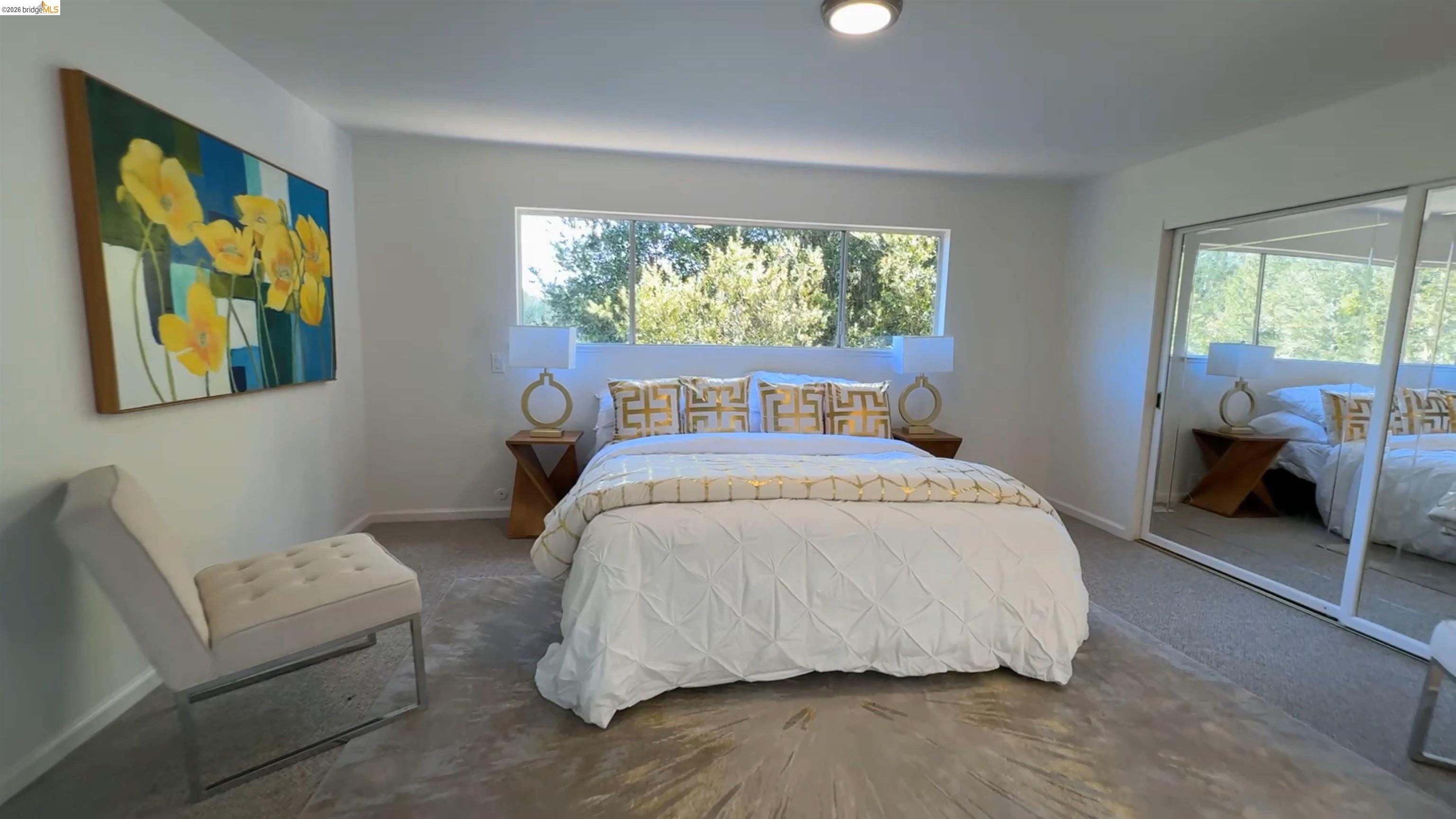 5051 Harrison Grade Road Sebastopol, CA 95472 - Photo 8 of 31 a bedroom with a bed and a couch