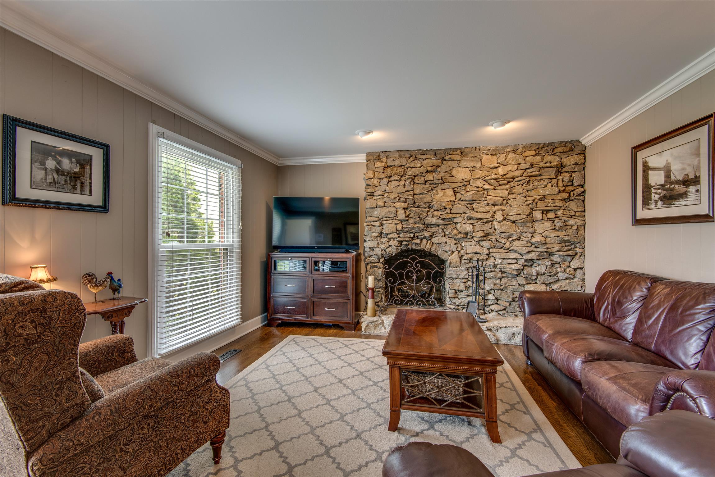 891 Sneed Road West Franklin, TN 37069 - Photo 13 of 30 a living room with furniture a rug and a flat screen tv