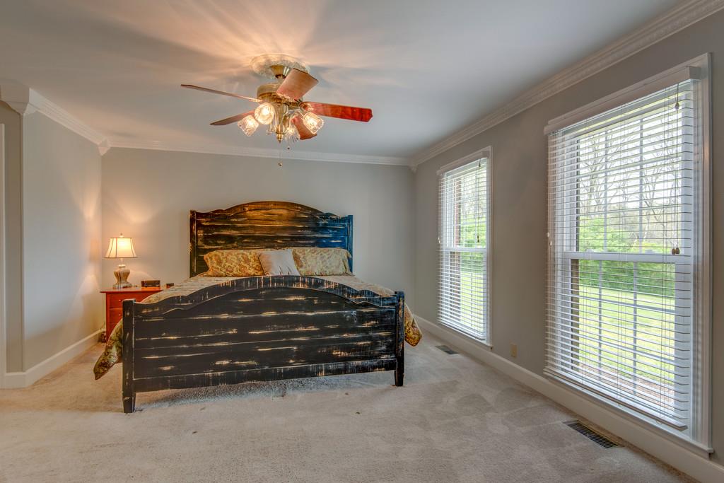 891 Sneed Road West Franklin, TN 37069 - Photo 15 of 30 a spacious bedroom with a bed and window