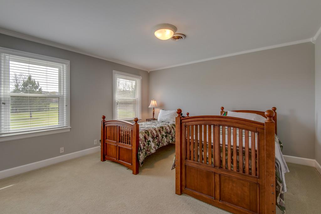 891 Sneed Road West Franklin, TN 37069 - Photo 20 of 30 a bedroom with a bed and a window