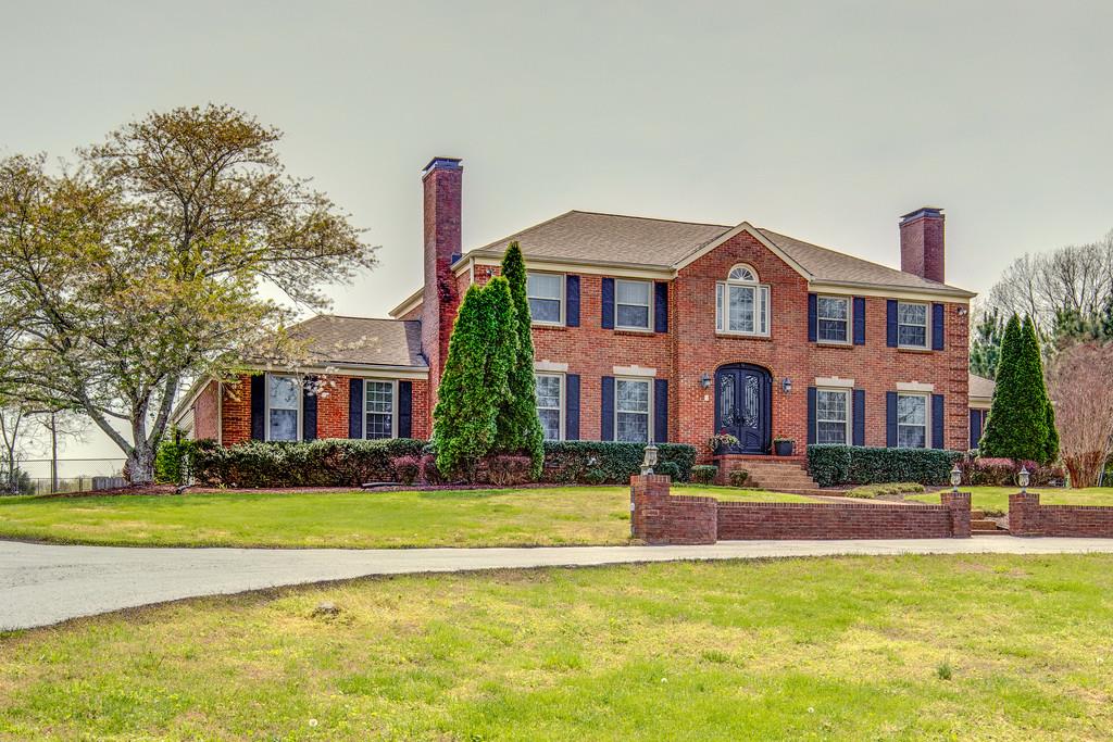 891 Sneed Road West Franklin, TN 37069 - Photo 2 of 30 a front view of building with yard and green space