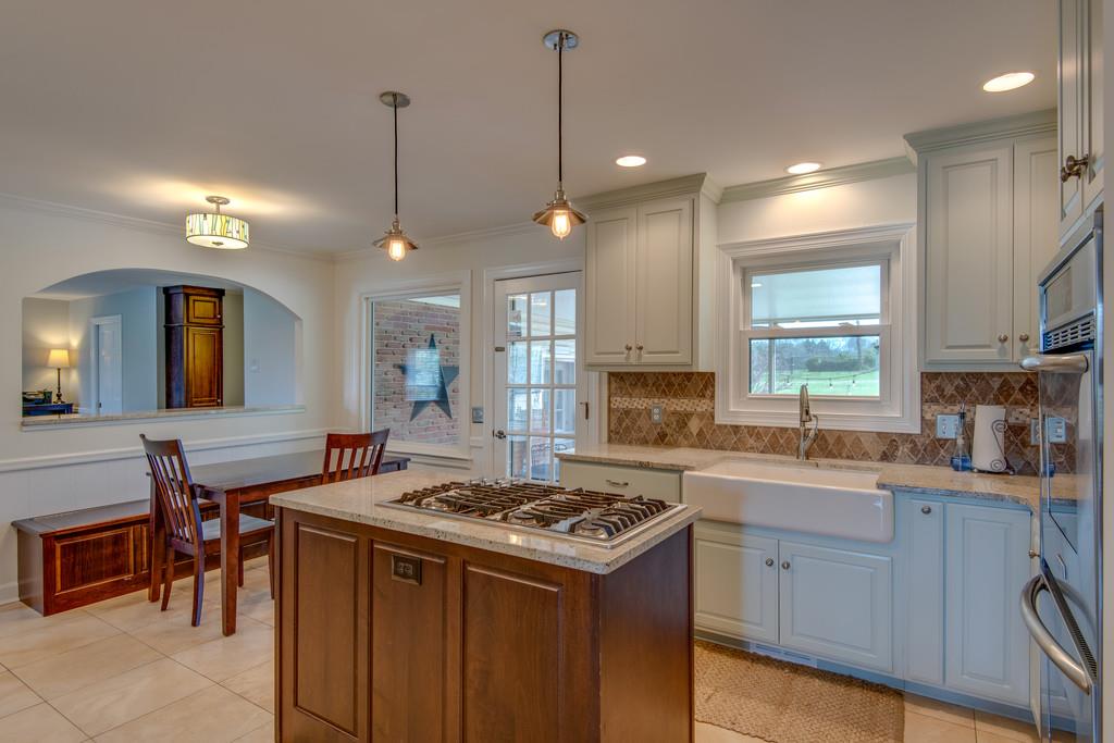 891 Sneed Road West Franklin, TN 37069 - Photo 8 of 30 a kitchen with a sink stove and cabinets