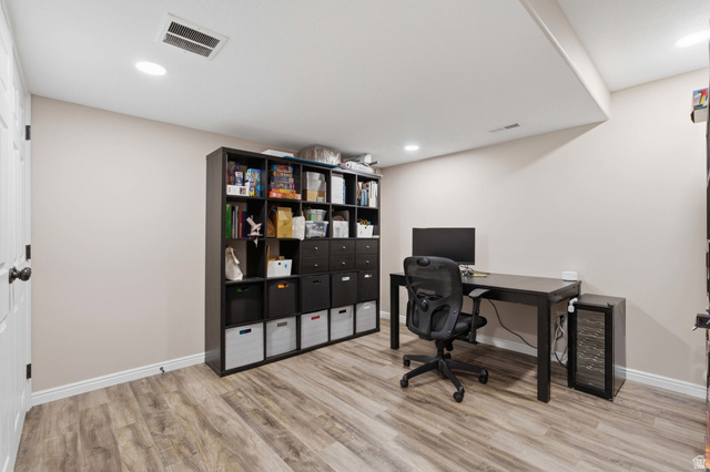 11189 Ohenry Road East Sandy, UT 84070 - Photo 44 of 44 Versatile room featuring wood-finish flooring, recessed ceiling lighting, and a neutral color palette