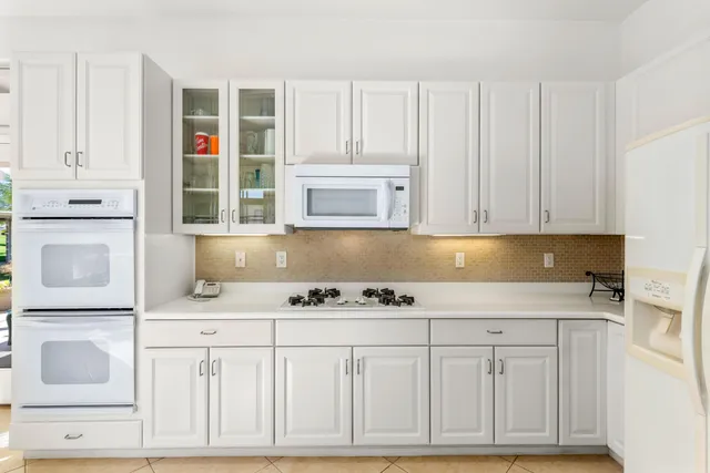 a living room with fireplace furniture and a chandelier