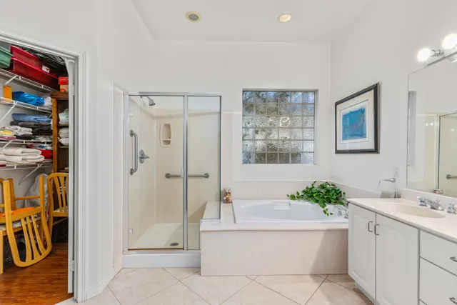 a spacious bathroom with a granite countertop sink mirror and toilet