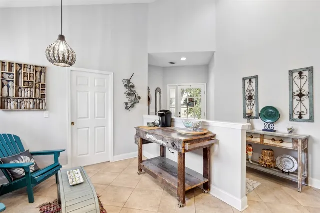 a kitchen with granite countertop white cabinets and sink