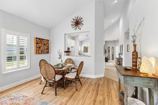 a living room with furniture a large window and a flat tv screen