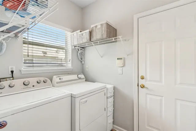 a view of a chair and tables in the backyard of the house