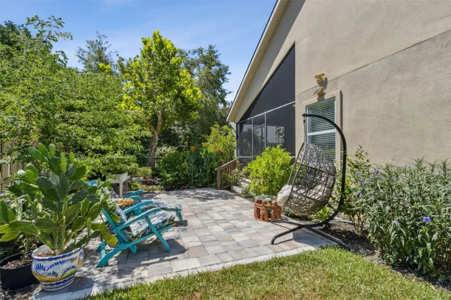 an aerial view of ocean and residential houses with outdoor space