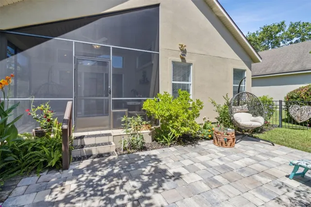 an aerial view of lake and residential houses with outdoor space