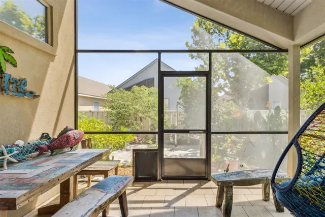 a view of a chairs and table in a backyard