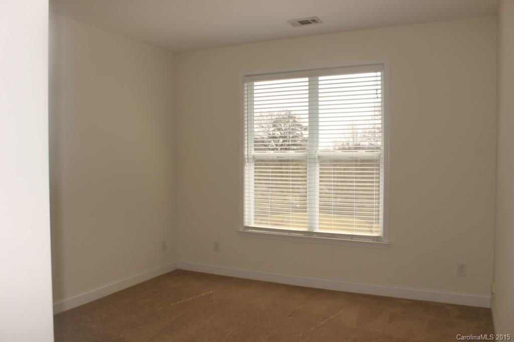 1000 East Woodlawn Road, Unit 405 Charlotte, NC 28209 - Photo 13 of 15 a view of an empty room with a window