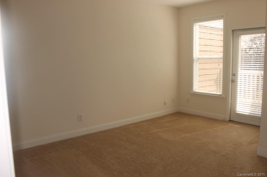 1000 East Woodlawn Road, Unit 405 Charlotte, NC 28209 - Photo 8 of 15 an empty room with a window