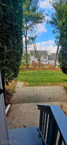 a view of a backyard of the house