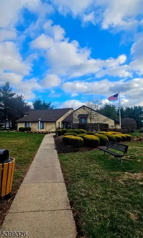 a view of a garden with sitting area