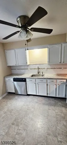 a view of a kitchen with stainless steel appliances granite countertop a sink and a stove