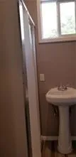 a bathroom with a sink and mirror
