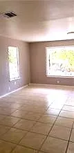 a view of an empty room and a window