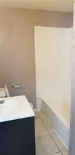 a bathroom with a sink and a bathtub