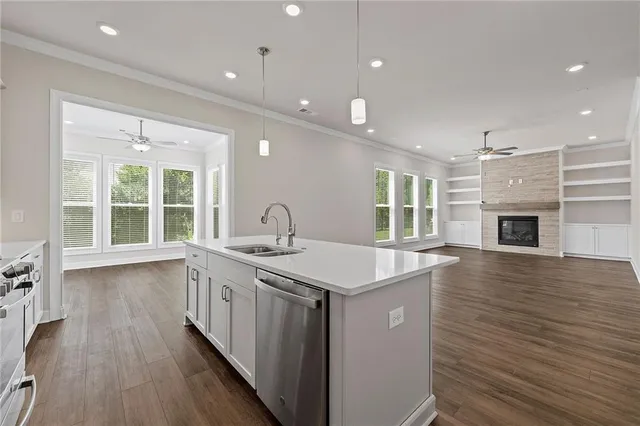 a kitchen with a sink and stove