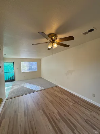 a kitchen with a refrigerator and a stove top oven