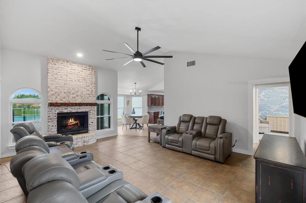 9346 Homestead Lane Forney, TX 75126 - Photo 5 of 39 Large living area with beautiful gas fireplace, recently updated with new trim and a German Schmeer finish.