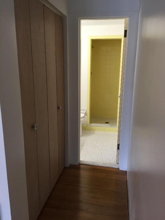 200 Swanton Street, Unit 238 Winchester, MA 01890 - Photo 4 of 7 a view of an empty room with wooden floor