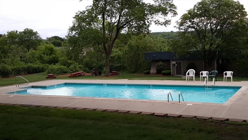 200 Swanton Street, Unit 238 Winchester, MA 01890 - Photo 6 of 7 a view of swimming pool with lawn chairs yard