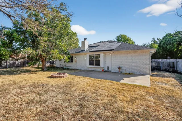a house view with a backyard space